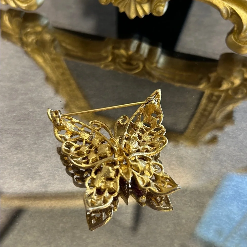 Elegant Gold Butterfly Brooch with Pink Accents